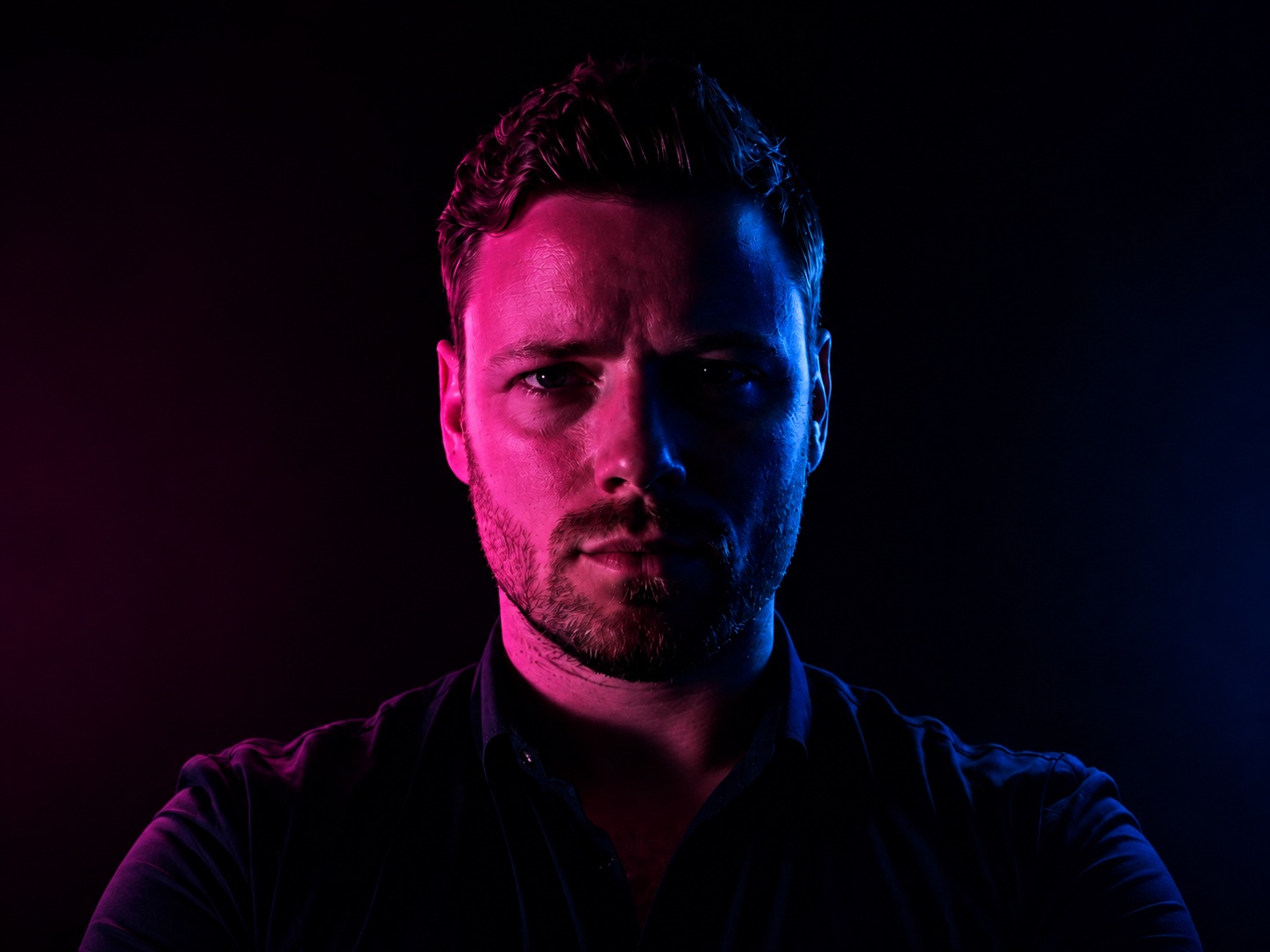 Dramatically lit portrait illustrating the role of light in scenography.